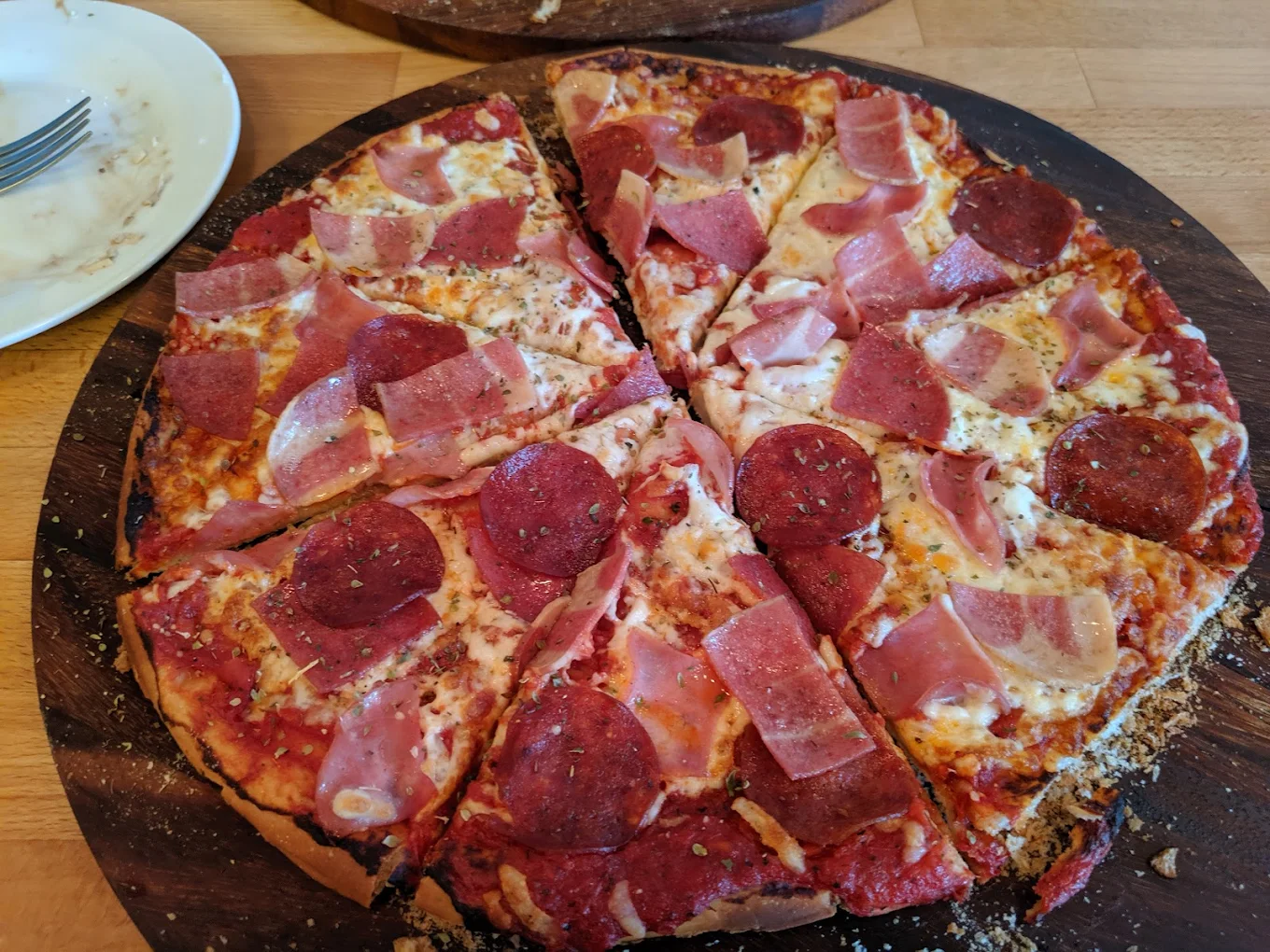 Guru butter chicken pizza signature dish at Avatara Pizza Shawnessy Calgary AB